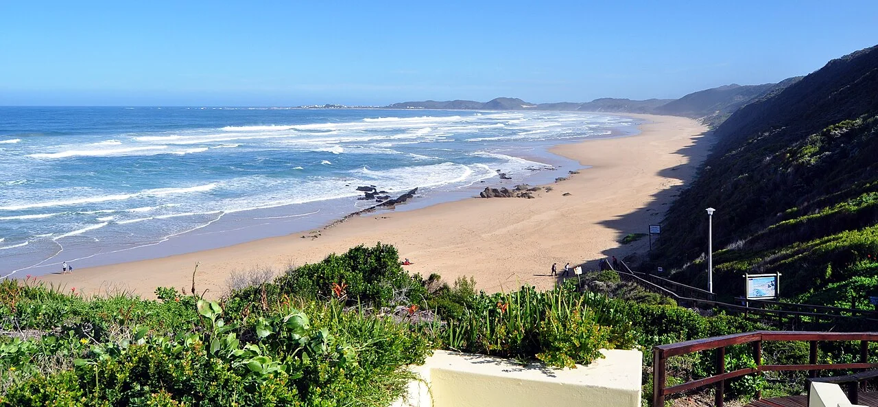 Clifftop view over Brenton-on-Sea from a wooden viewing deck on Fisherman's Walk, long beach below, near Knysna