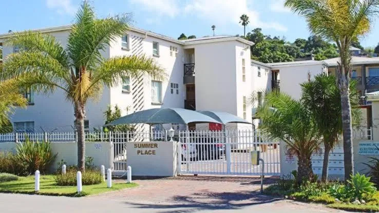 9 Summerplace — gated apartment complex exterior with palm trees, Knysna