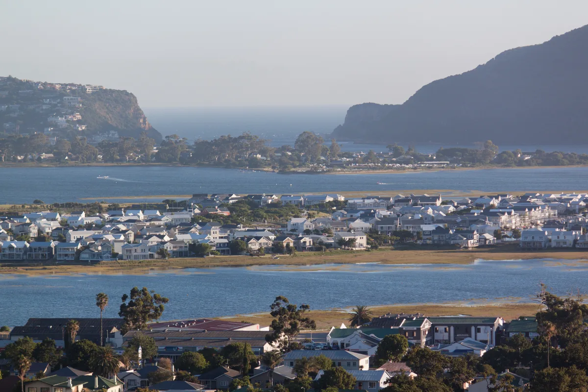 Aerial view of the Knysna Lagoon with Thesen Islands in the foreground, Leisure Isle in the middle distance, and the Knysna Heads framing the lagoon mouth