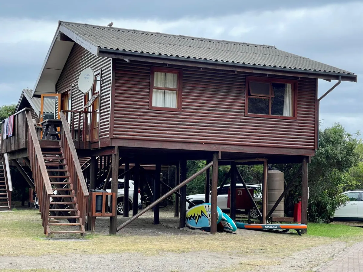 A raised timber cabin on stilts at Ebb-and-Flow Rest Camp, Wilderness