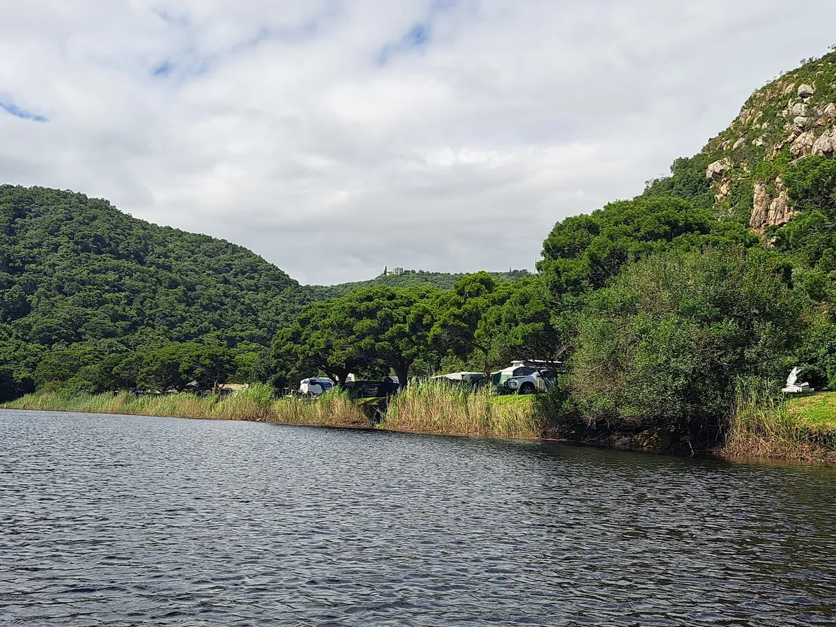 The Touw River at Ebb-and-Flow Rest Camp in Wilderness National Park, forested hills on both banks